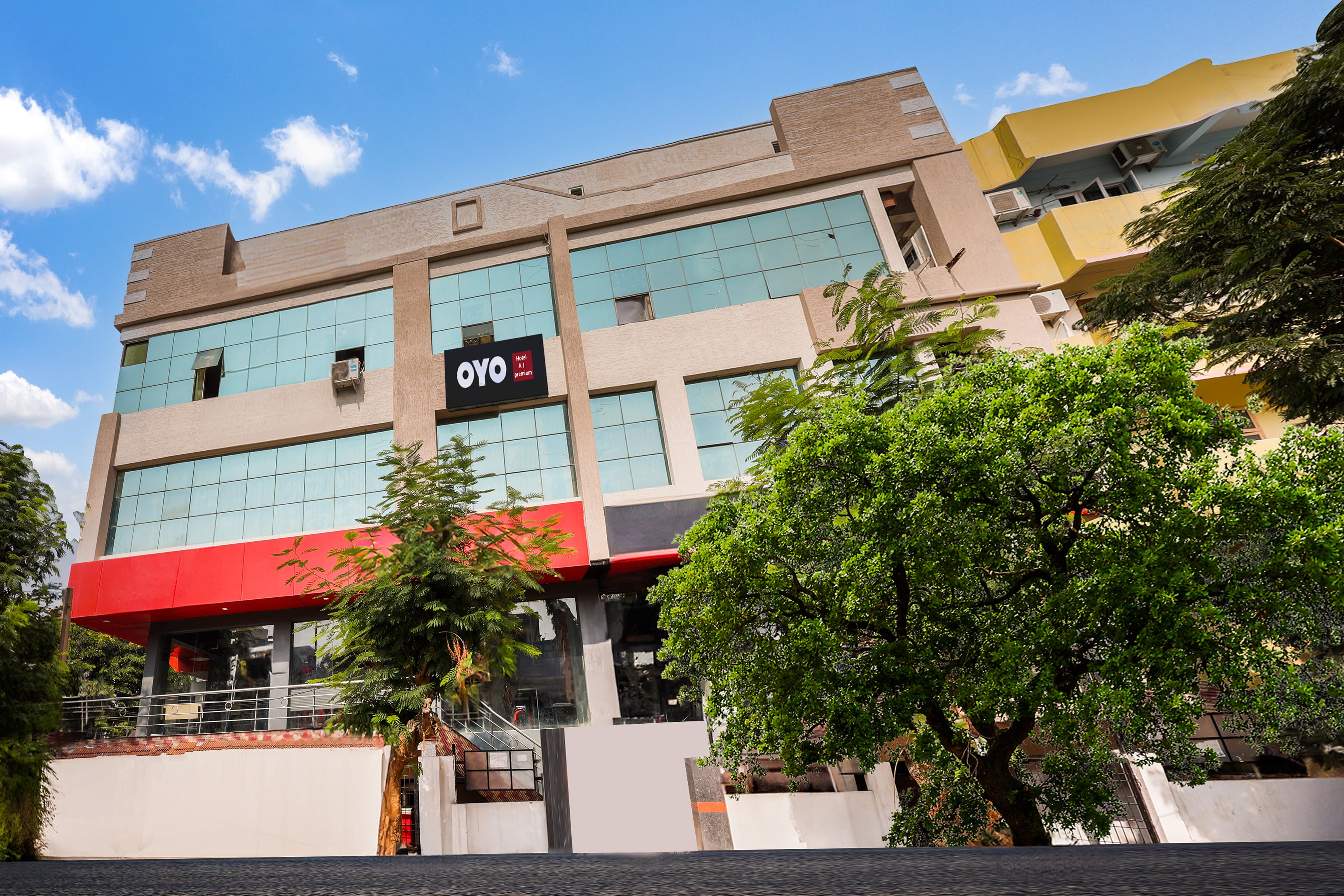 Hotel O A1 Premium AC Rooms - Tap to explore photos