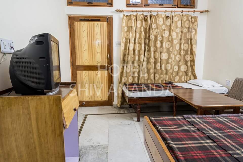 Hotel Shivananda - Tap to explore photos