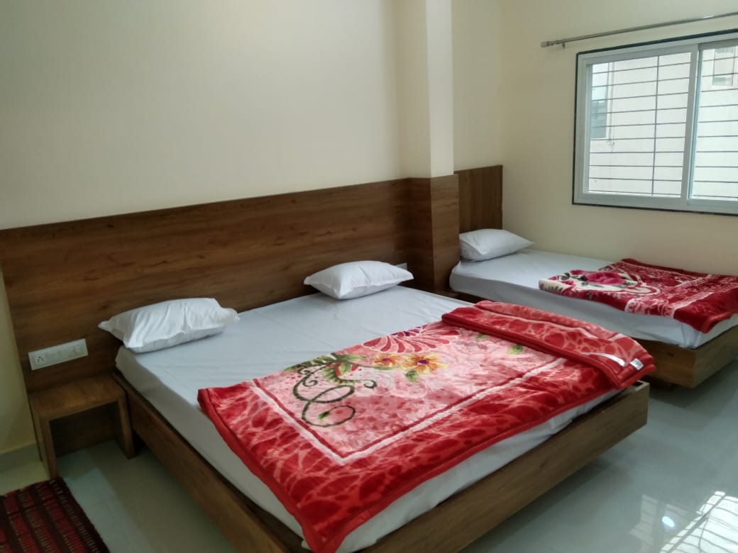 Ganesh Guest House - Tap to explore photos