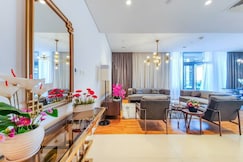ELIVAAS Curated Luxury 3B with Maid's Room | Partial Sea View, Dubai