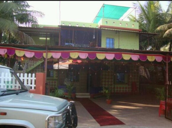 Amrapali Holiday Home - Tap to explore photos