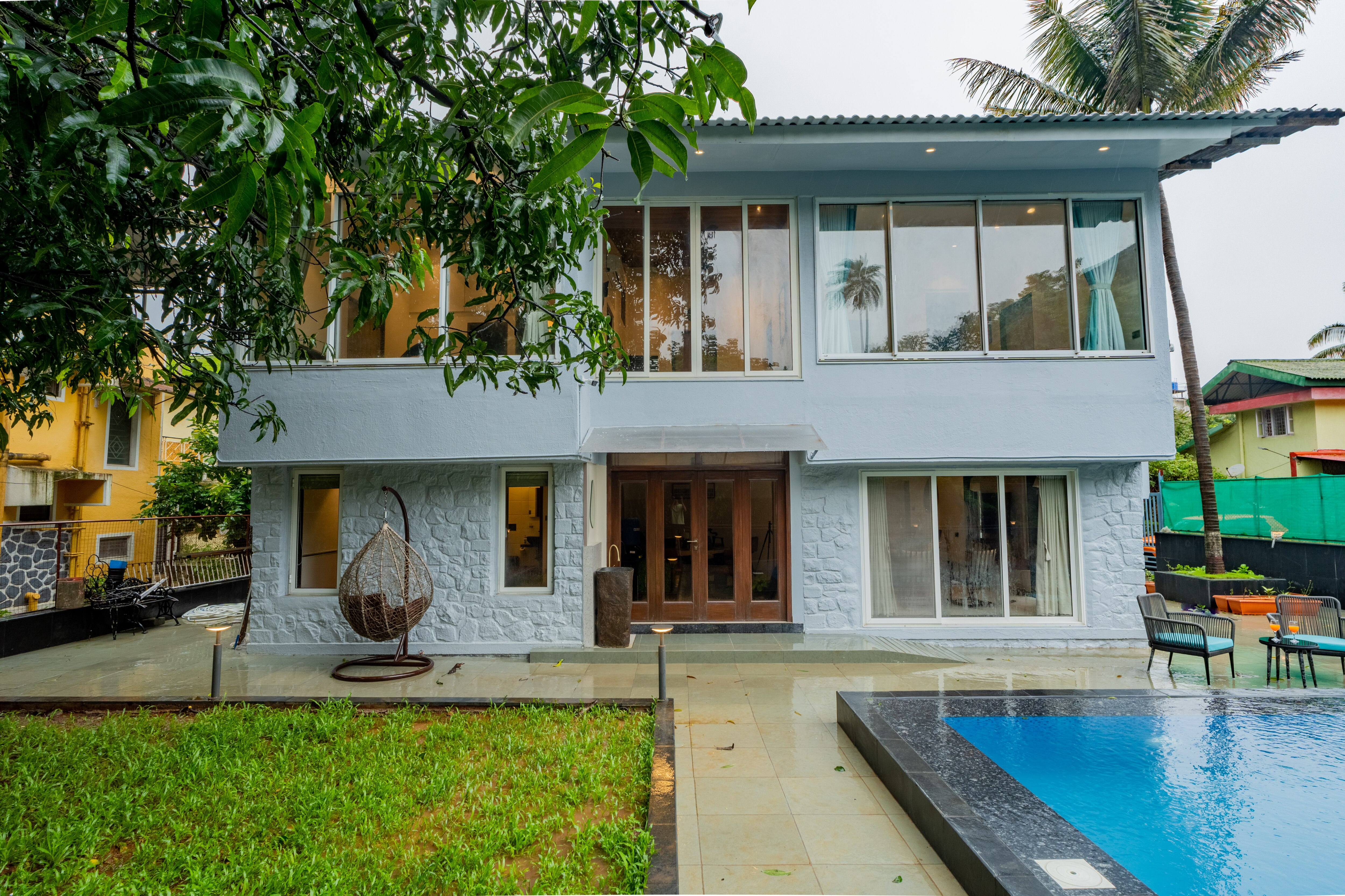 ELIVAAS 5BHK With pool and gazebo | House of Q - Tap to explore photos