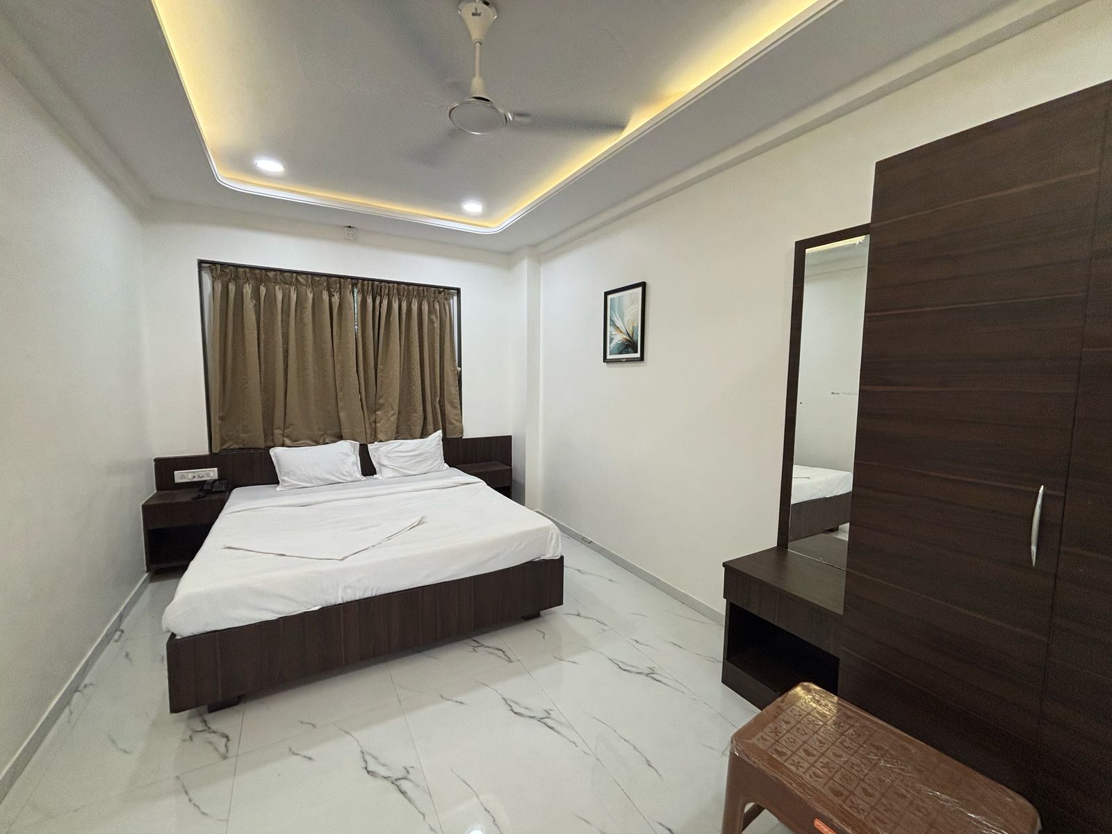 Hotel Malhar Empire - Tap to explore photos