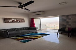 Panoramic Stadium View | 1BHK High Floor Apartment, Wadgaon