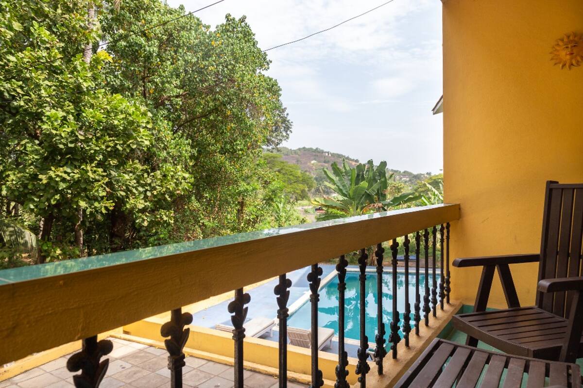 Dona Karen | 2 BHK Pool-facing Apartment - Tap to explore photos