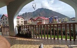balcony with mountain & garden view