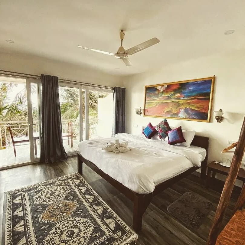 Sea View Deluxe Room of charming resort in Mandrem - Tap to explore photos