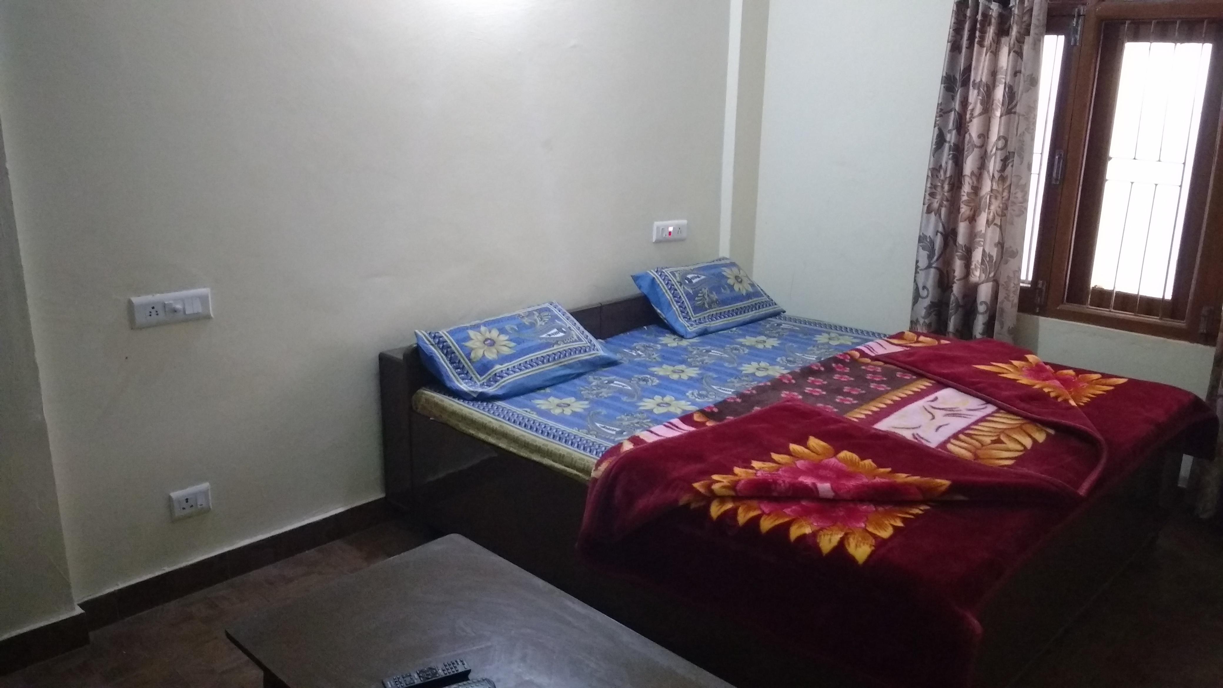 Sunrise Guest House (Deluxe Room) - Tap to explore photos