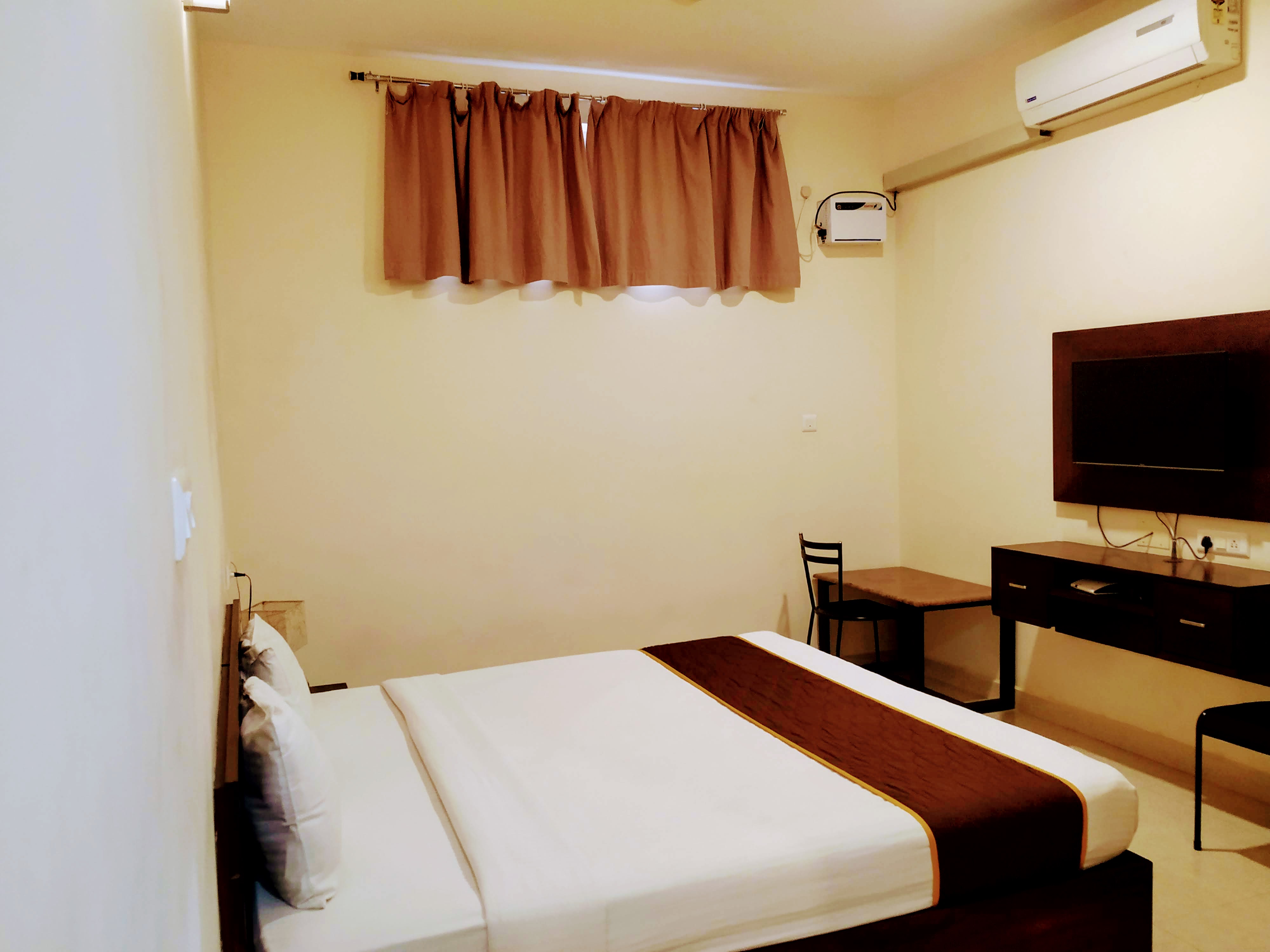 Dhanaram A/C Rooms - Tap to explore photos