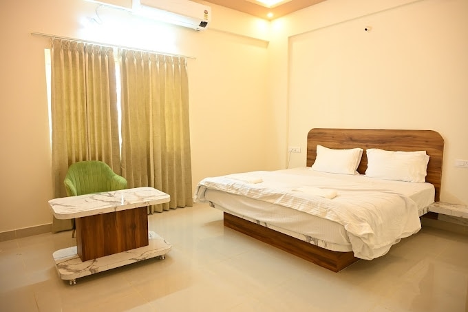 Hotel Raaya Grand Inn - Tap to explore photos