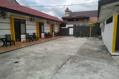 Hotel O Yellow White Guesthouse Palu, Palu