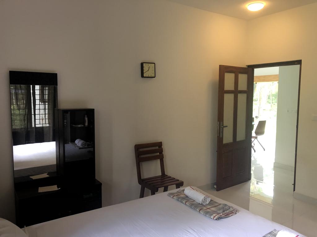 Kannur Beachway Homestay | Room & Caretaker - Tap to explore photos