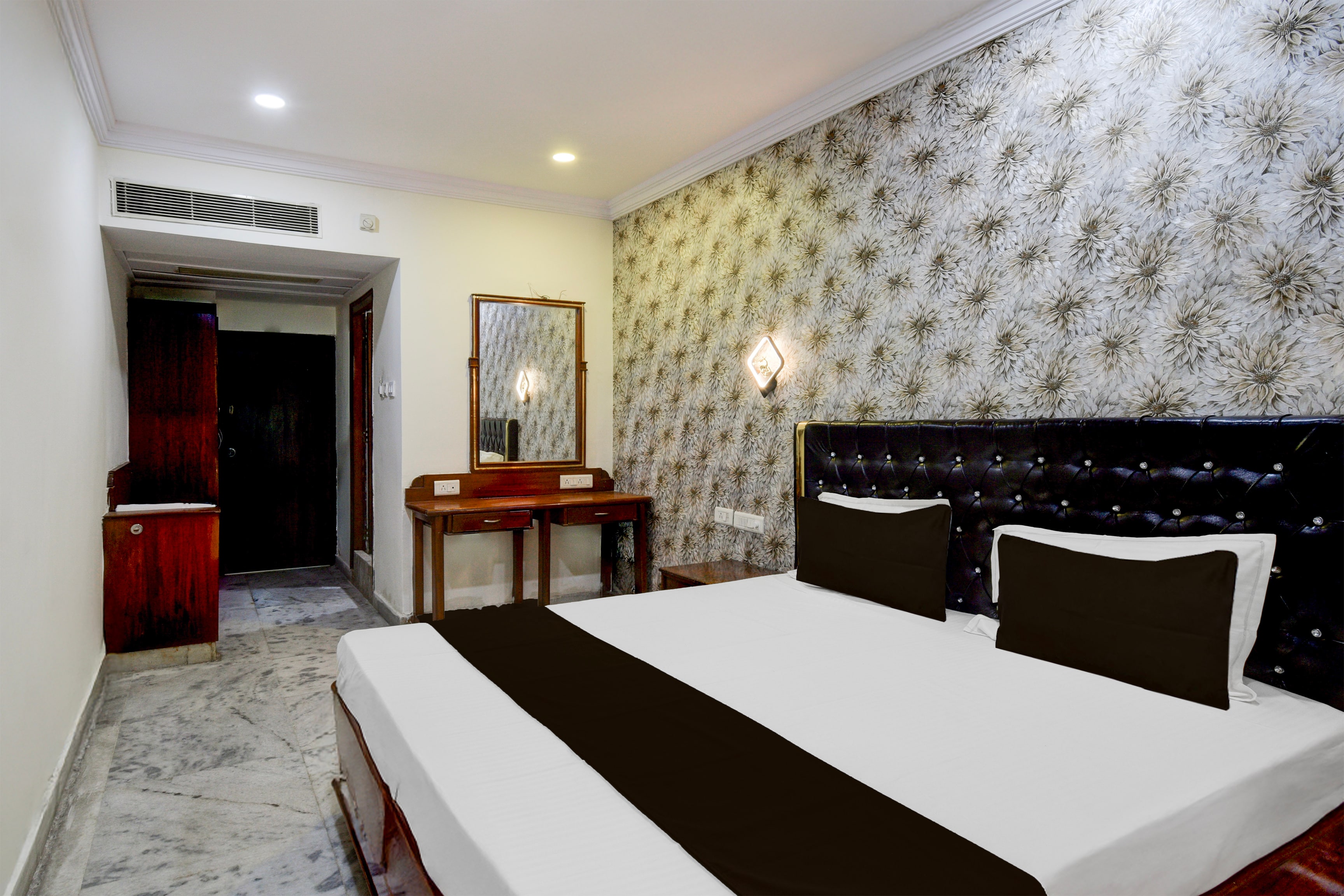SPOT ON Surya Luxury Rooms - Tap to explore photos