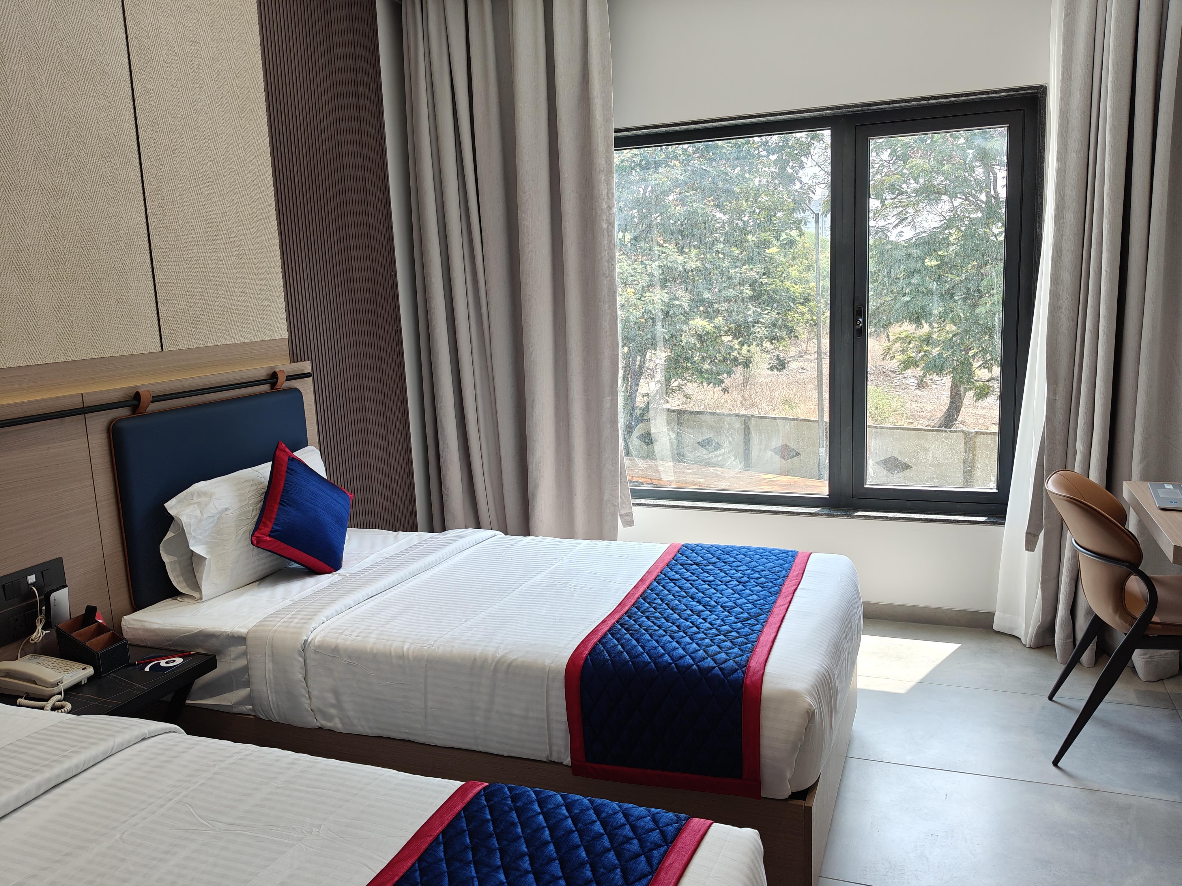 Zip By Spree Hotels Chinchwad - Tap to explore photos