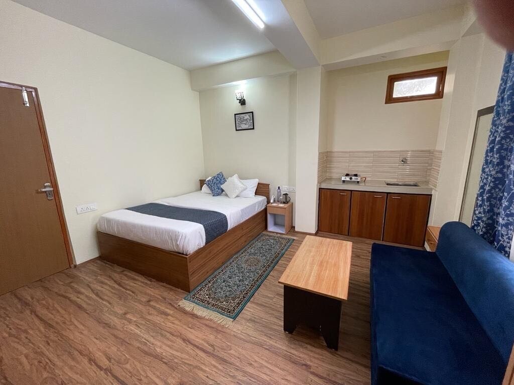 Hotel O Home Urvi Griham - Tap to explore photos