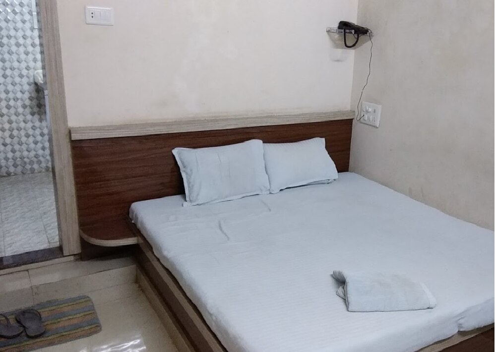 Hotel Mrityunjay by WB Inn - Tap to explore photos