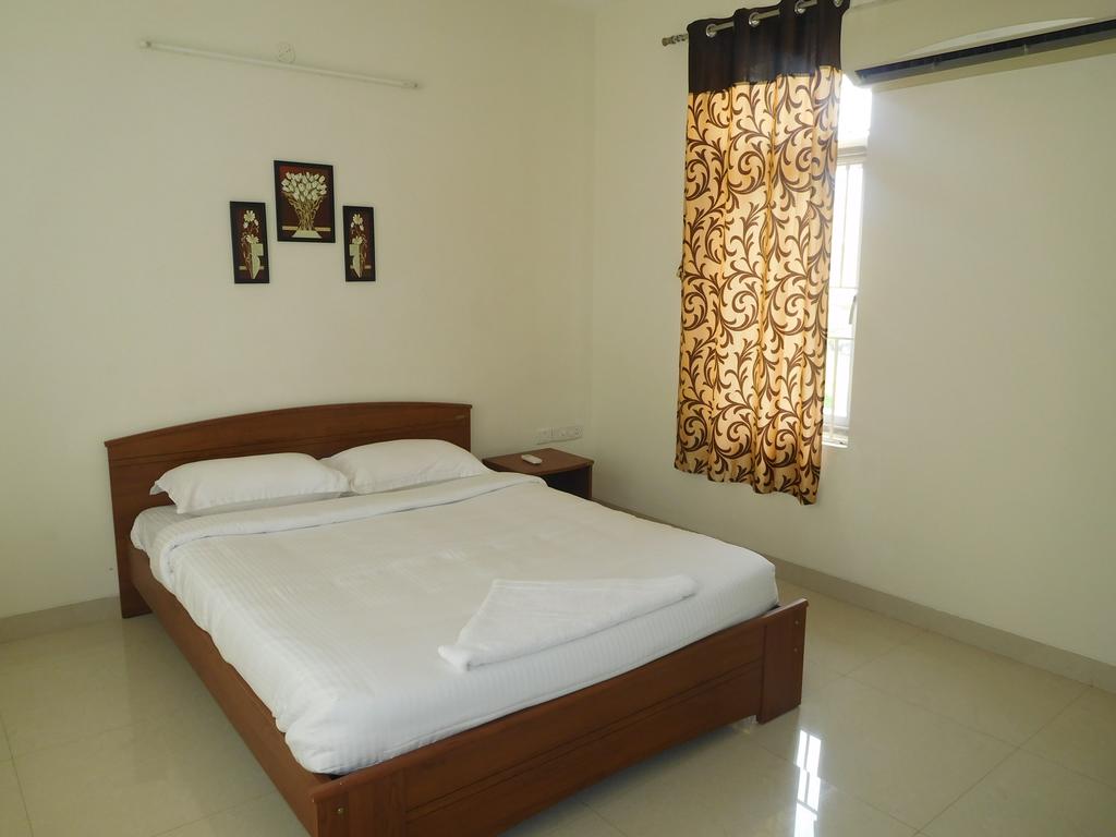 Tulip Mahindra World City | Rooms & Caretaker - Tap to explore photos