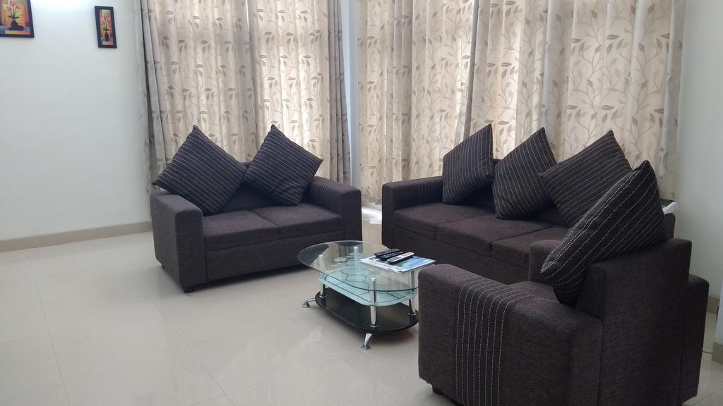 Tulip Mahindra World City | Rooms & Caretaker - Tap to explore photos
