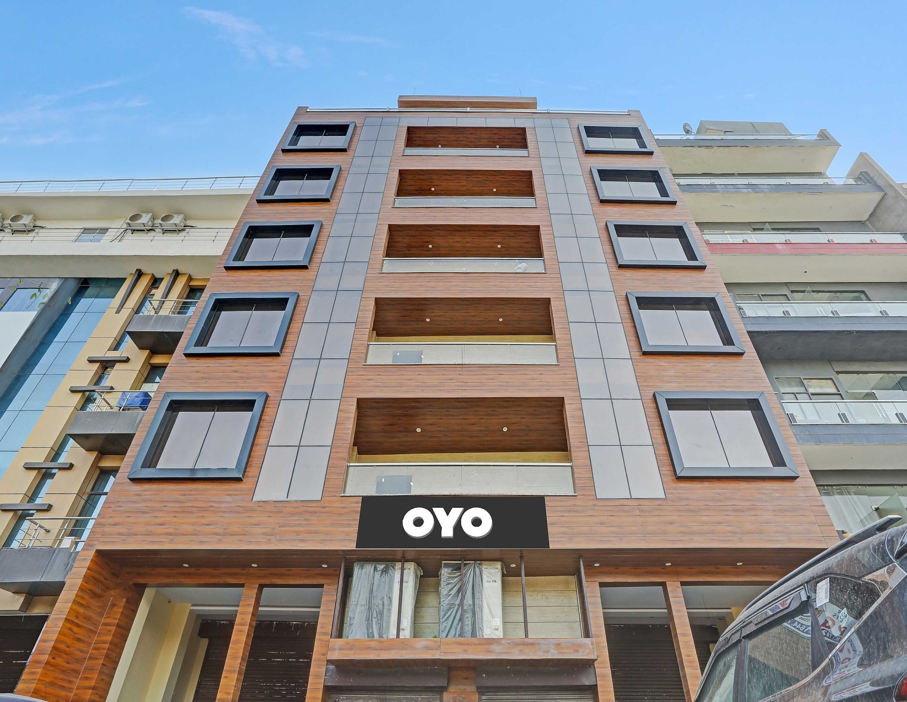 Capital O Mt Corporate Stays Near Iskcon Temple Noida - Tap to explore photos