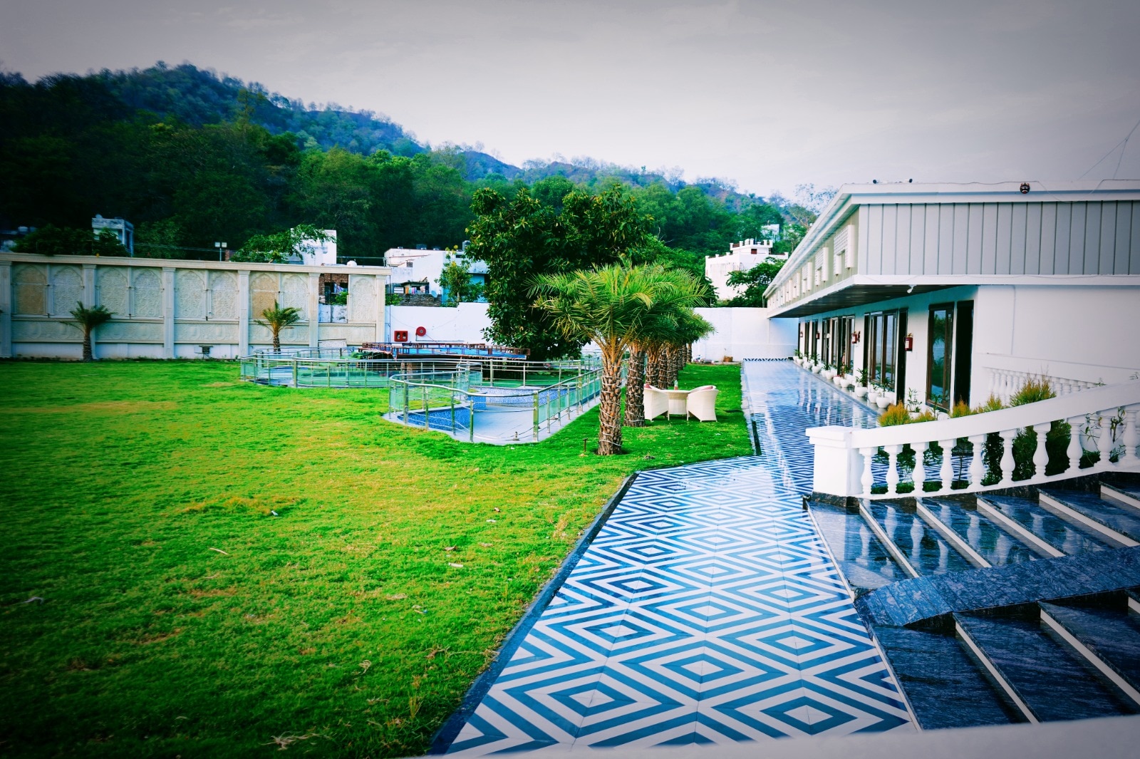 The Veda Greens Resort - Tap to explore photos