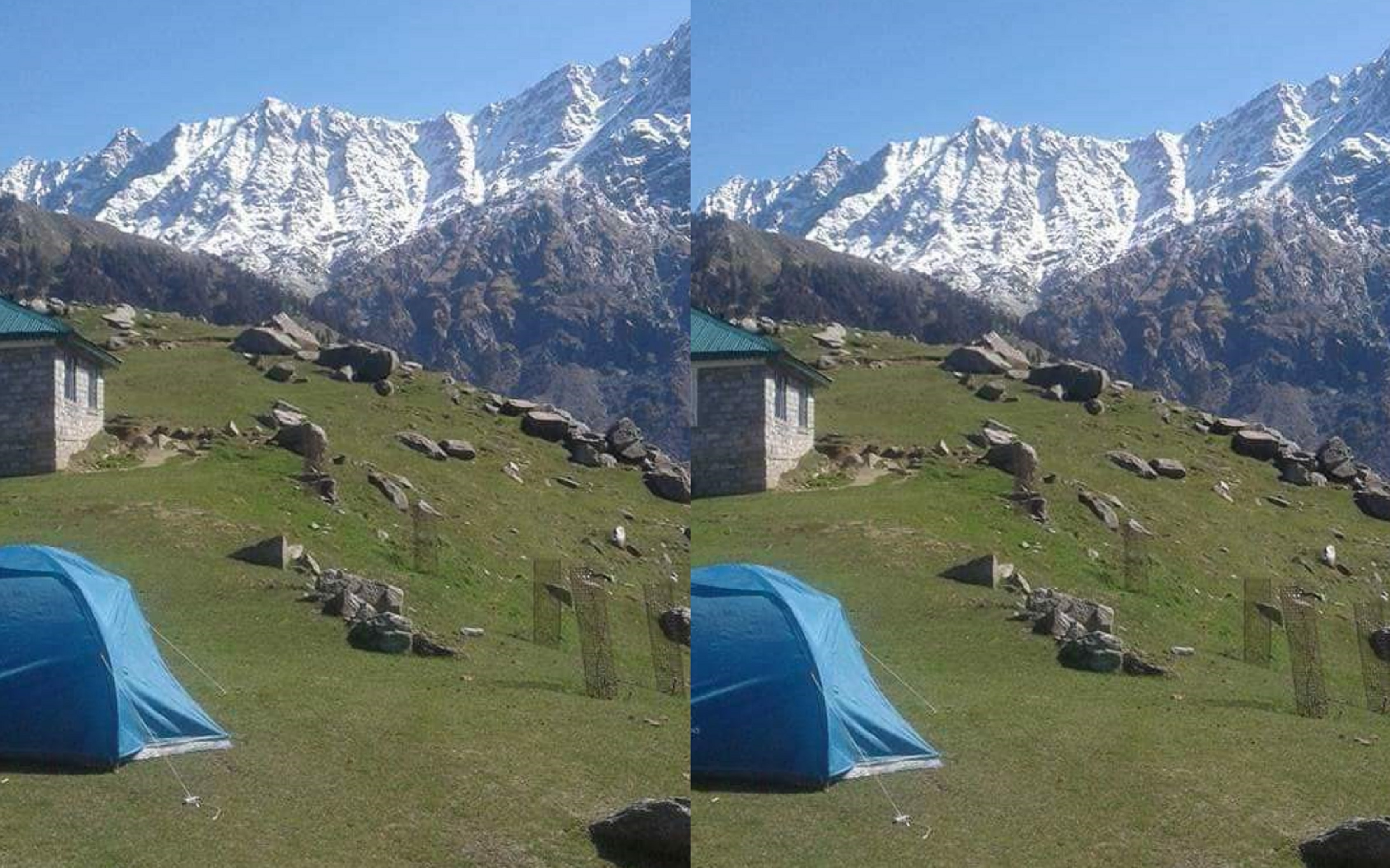Blue camping tents pitched at Triund Top with mountain peaks in the background
