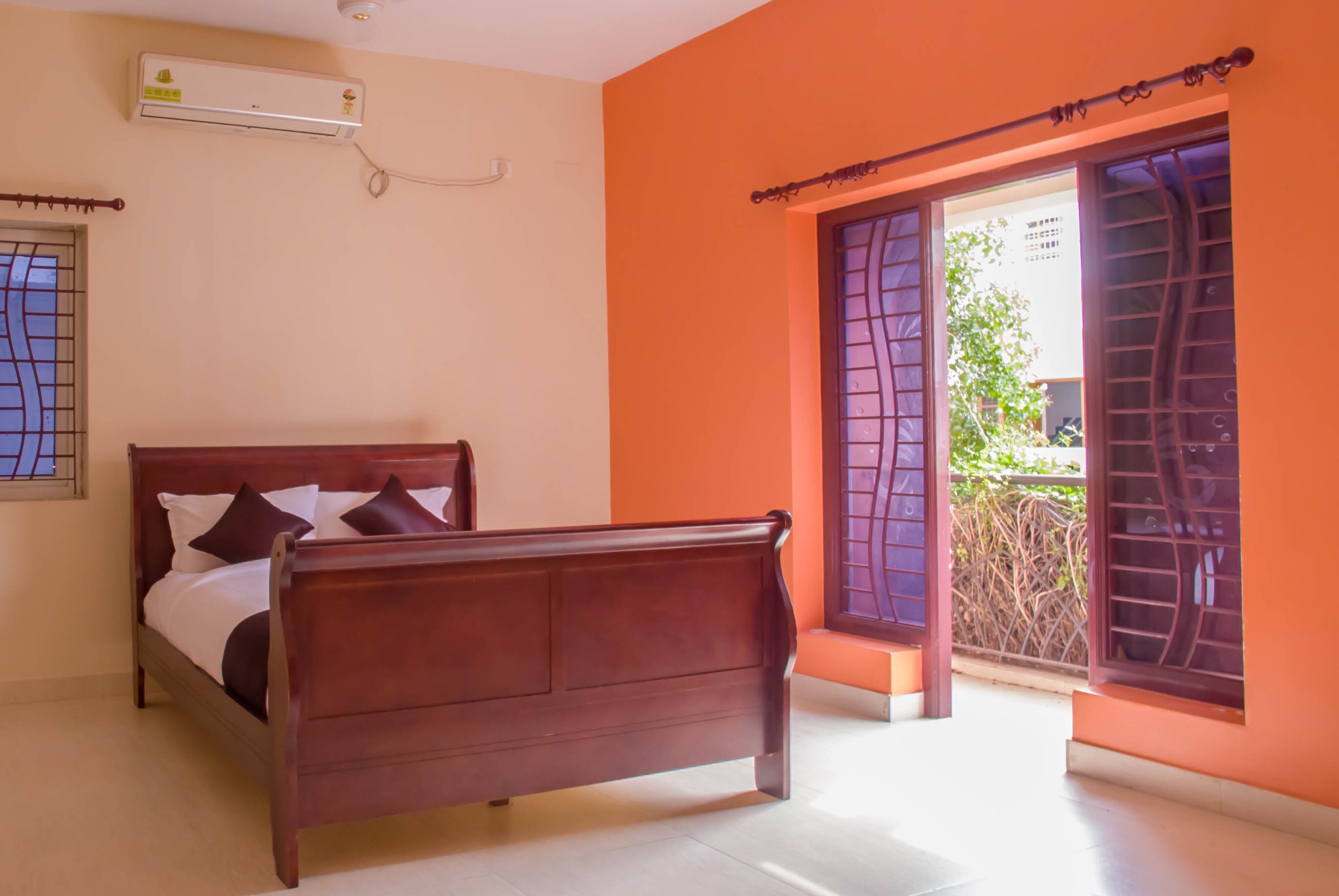 TrustedStay Dhanya Gardens - Tap to explore photos