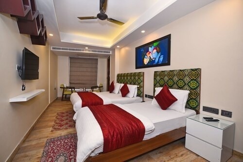 Staybook Hotel Nitya Maharani - Tap to explore photos
