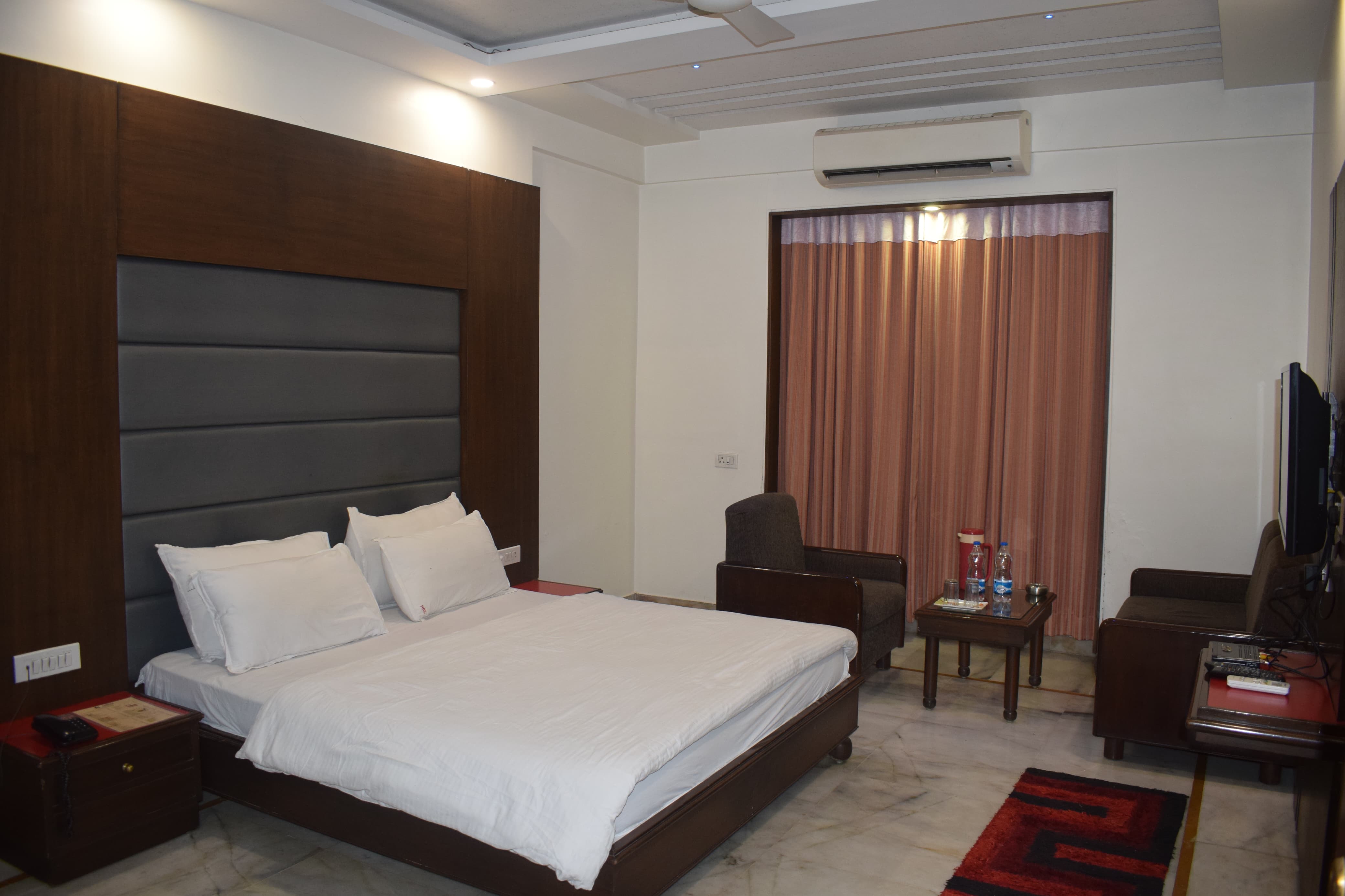 Hotel Ambaji International - Tap to explore photos