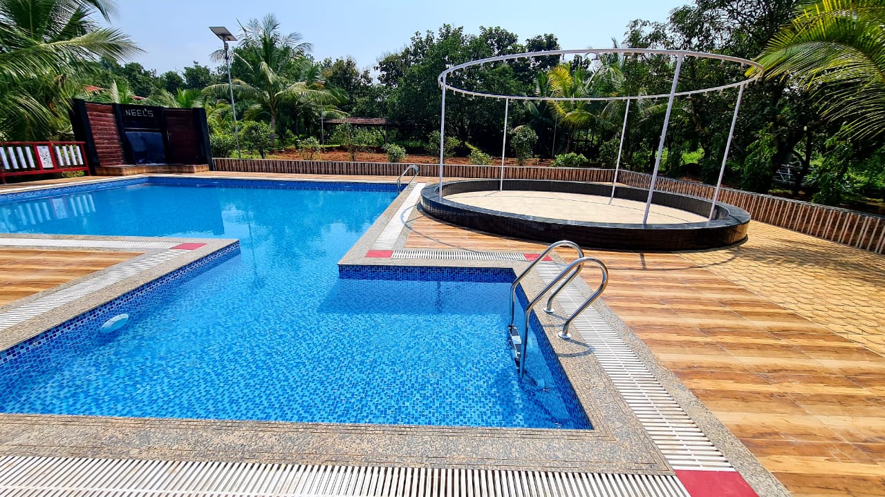 The Neel's Resort | Rooms & Pool - Tap to explore photos