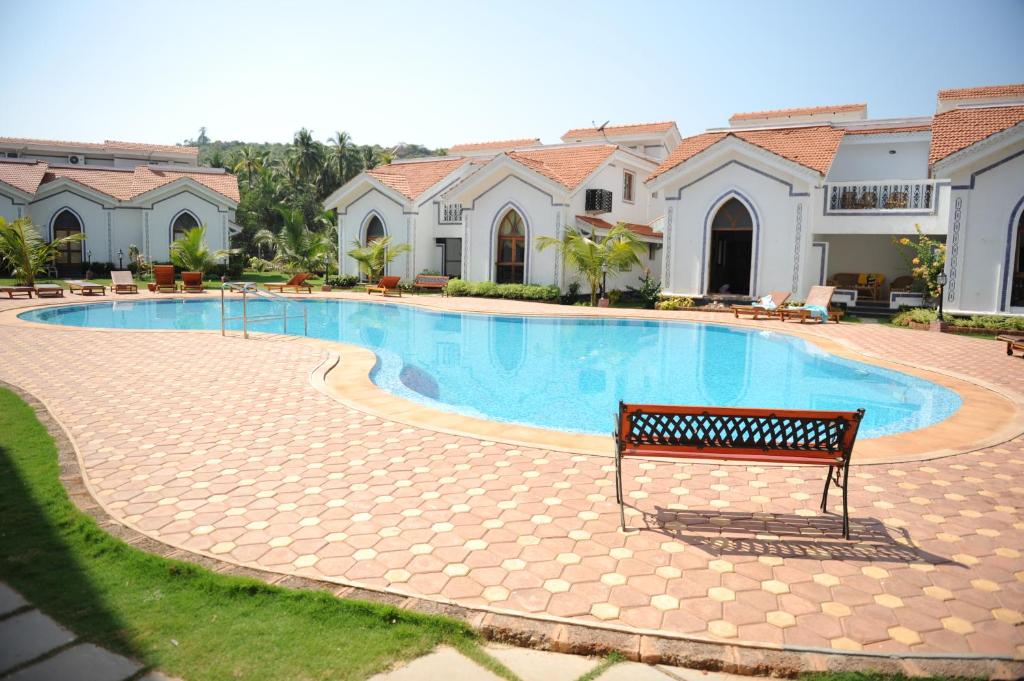AirStay 1BHK Apartement in Arpora | Shared Pool - Tap to explore photos