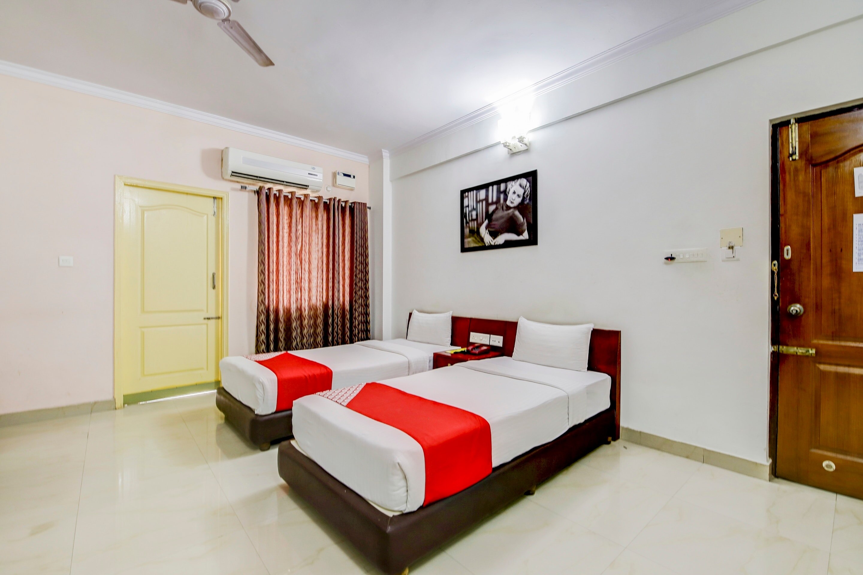 OYO White Brick's Inn, Near Palace Grounds. - Tap to explore photos