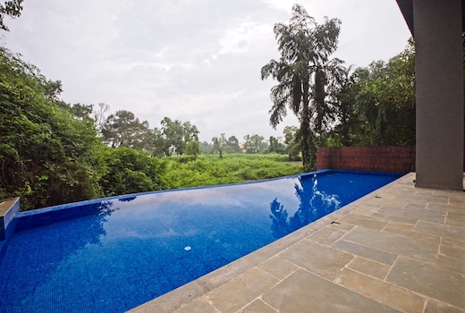 tisyastays | Spacious 1BHK Apartment with Infinity Pool, 5mins to beach