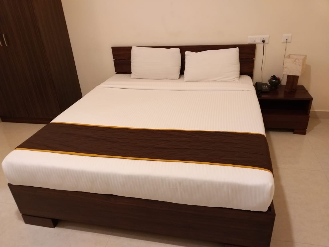 Dhanaram A/C Rooms - Tap to explore photos