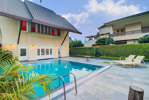 StayVista at Ekant Villa w/ Bonfire & Outdoor Pool